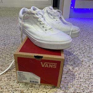All white vans old skools